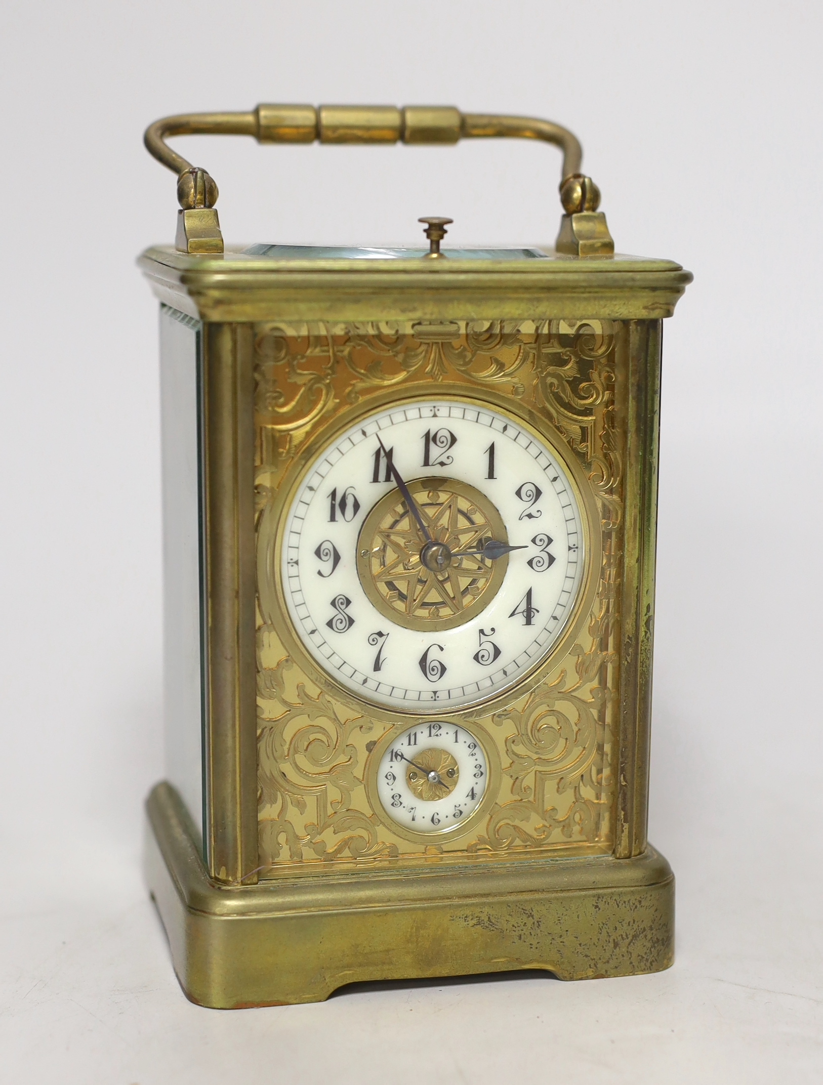 An early 20th century French brass sonnerie repeating carriage clock with alarm, 15cm tall